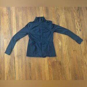 A tight fitting sports jacket. Size small and a dark gray color.